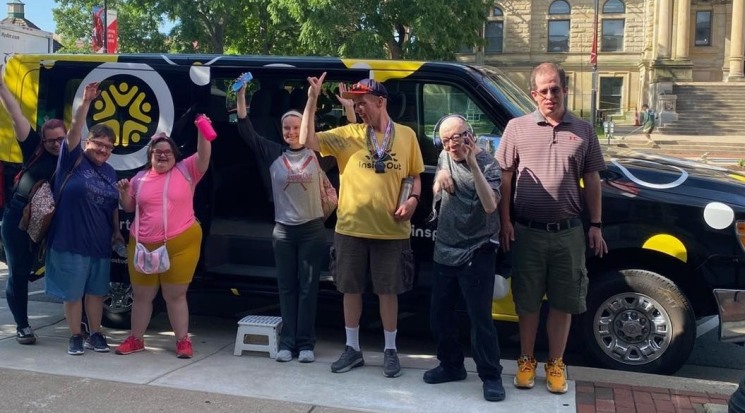 Group in front of van