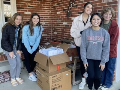 Youth Philanthropy Committee members deliver bags to The Caring Closet