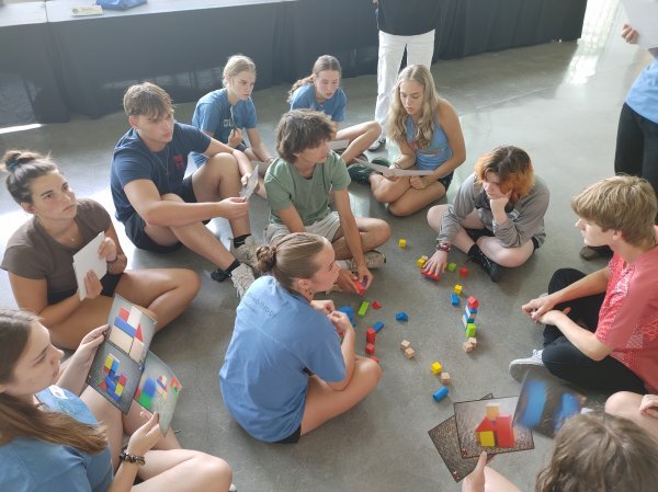 Kids sitting on floor with building blocks